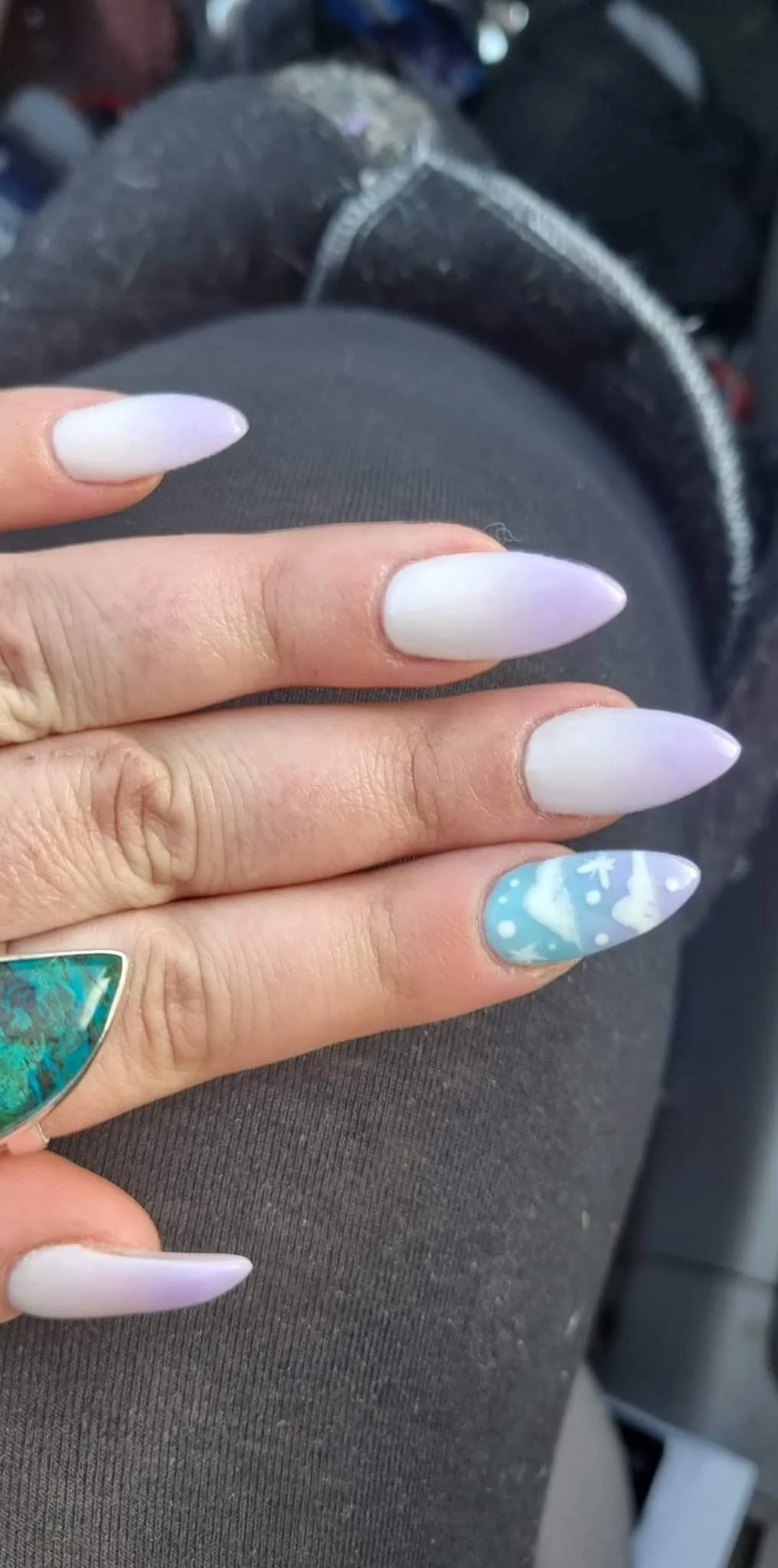 White and lilac ombre stiletto nails with a hand-painted blue winter scene accent nail